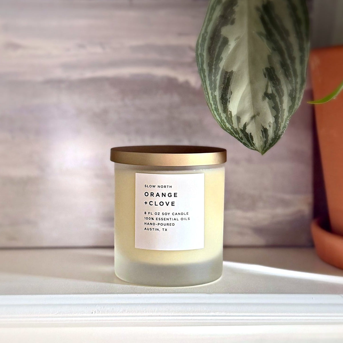 Orange + Clove soy candle by Slow North, hand-poured in Austin, Texas